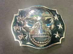 Raised Skull With Teeth Grin Black And Silver Color Belt Buckle Star Surround