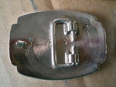 2 silver tone shiny belt buckles