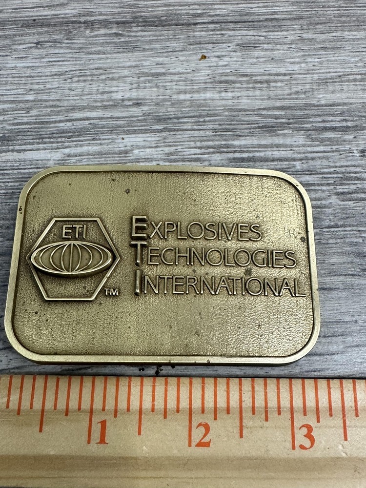 Explosives Technologies International ETI Belt Buckle Mens Brass Tone CD Hit