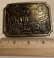 Belt Buckle With A Man And A Horse On It