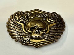 Dimensional Skull Head With Wings And Flowers – Raised Metal Belt Buckle