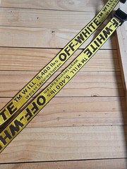 Off-White Industrial Belt in the yellow and black colorway, featuring a black…