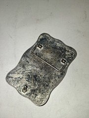western-style belt buckle features a silver-toned textured background