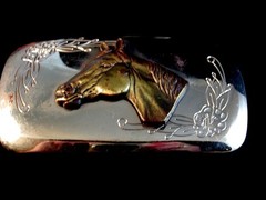 Horse belt buckle with floral decoration