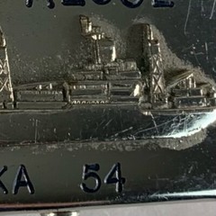 U.S. Navy belt buckle. “U.S.S. Algol AKA-54. Raised ship graphic.