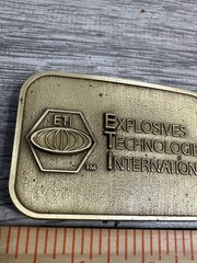 Explosives Technologies International ETI Belt Buckle Mens Brass Tone CD Hit