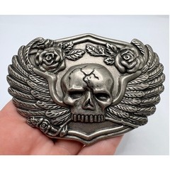 Silver-tone belt buckle featuring a skull with wings and roses