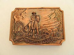 TALL IN THE SADDLE, WAGON TRAIL SCENE, BRASS COLOR, 2.5&Prime; X 3.5&Prime; BELT BUCKLE, NEW