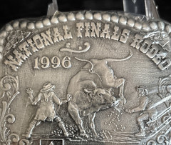 Hesston NFR 1996 Commemorative Belt Buckle New in Shrinkwrap Award Design Medals