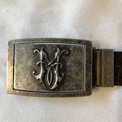 Fleur de Lis reversible pewter type belt buckle. Monogram M on the reverse side