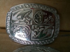 2 silver tone shiny belt buckles