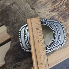 Unique vintage brass and steel belt buckle.