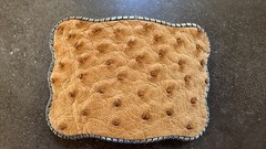 BUCKLE WALLET. TAN OSTRICH HIDE. TITANIUM ROPE EDGING.HOLDS ID, CREDIT CARDS, $.