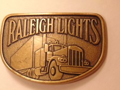Modern brass colored advertising / trucker belt buckle: Raleigh Lights