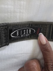 Bison Designs Tap Cap 38 mm belt featuring a gunmetal-colored bottle opener