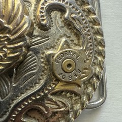 VINTAGE AMERICAN EAGLE BELT BUCKLE WITH HORNADY 12 AND 2 S&W 40 SHELLS