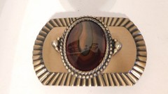 Gold & black belt buckle with brown stone