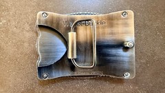 BUCKLE WALLET. TAN OSTRICH HIDE. TITANIUM ROPE EDGING.HOLDS ID, CREDIT CARDS, $.