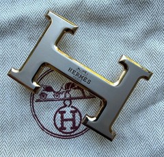Hermès belt buckle in polished palladium, complete with its signature pouch