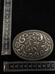 Vintage silver toned belt buckle feature floral design and roped edge RARE