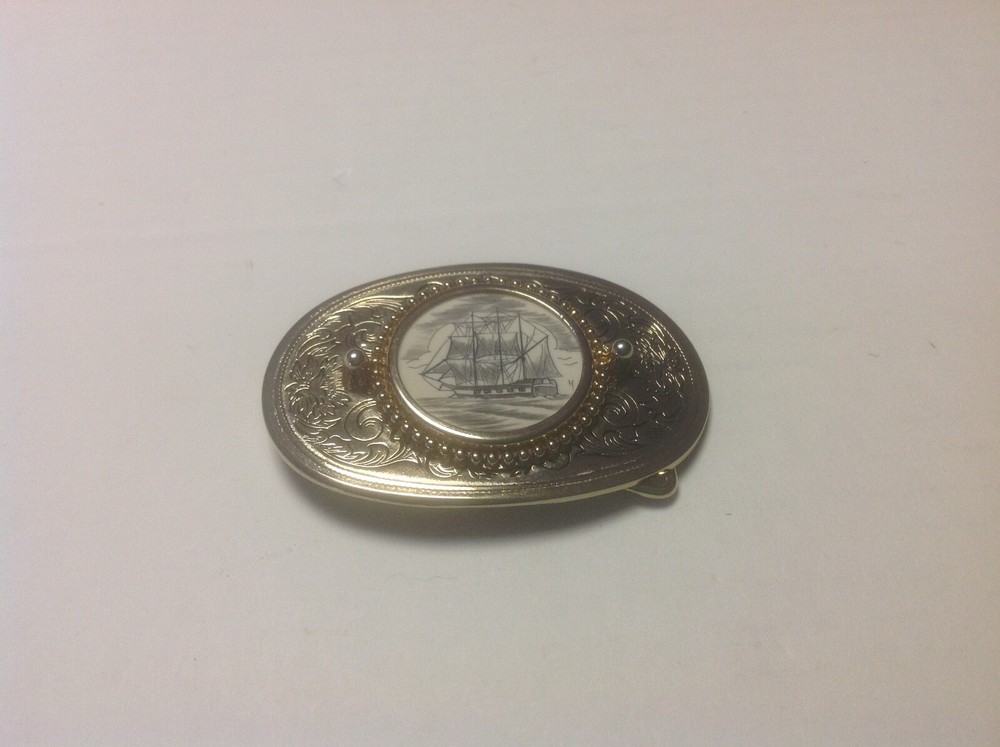 Gold Colored Belt Buckle With Sailing Vessel Artwork