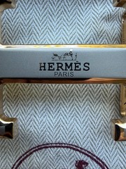 Hermès belt buckle in polished palladium, complete with its signature pouch