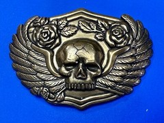 Dimensional Skull Head With Wings And Flowers – Raised Metal Belt Buckle