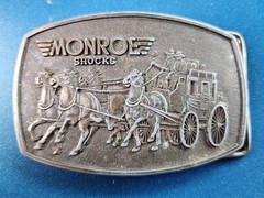VTG 1980s MONROE SHOCKS BELT BUCKLE WILD WEST STAGECOACH SOFT RIDE