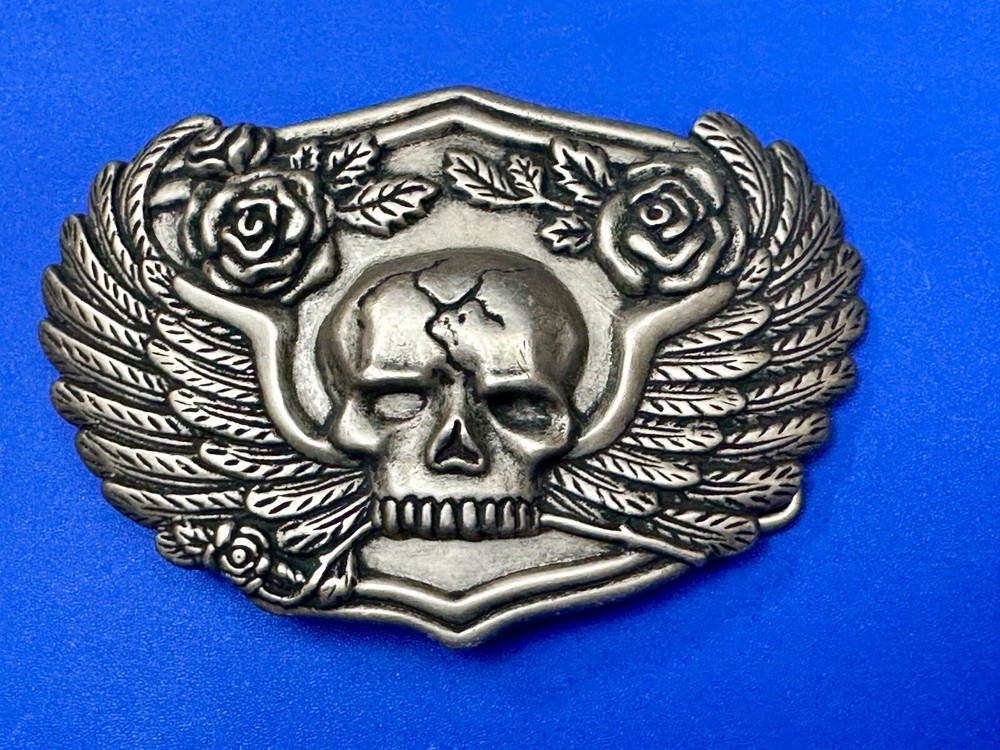 Dimensional Skull Head With Wings And Flowers – Raised Belt Buckle