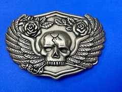 Dimensional Skull Head With Wings And Flowers – Raised Belt Buckle
