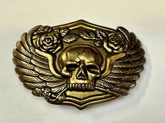 Dimensional Skull Head With Wings And Flowers – Raised Metal Belt Buckle