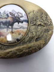 Artistic impression MOOSE belt buckle designed by Julie Zsupnik, 2004