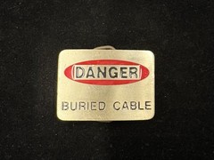 Vintage silver “Danger Buried Cabel” novelty belt buckle red and white RARE