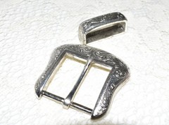 Pre-owned Belt Buckle, Silver in color. 2.5&Prime; x 2.5&Prime; Dated R 1999