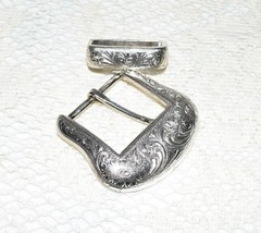 Pre-owned Belt Buckle, Silver in color. 2.5&Prime; x 2.5&Prime; Dated R 1999
