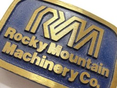 RM Rocky Mountain Machinery Co Blue & Gold Tone Belt Buckle Dynabuckle Utah