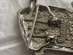 2004 Olander silver tractor belt buckle spinning back wheel