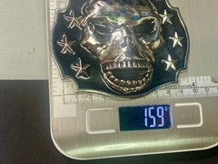 Raised Skull With Teeth Grin Black And Silver Color Belt Buckle Star Surround