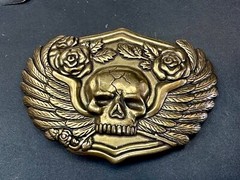 Dimensional Skull Head With Wings And Flowers – Raised Metal Belt Buckle