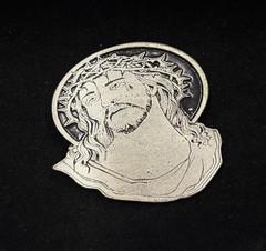antique silver belt buckle depicts the head of Christ wearing a crown of thorns
