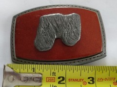 LONG HAIR DOG LHASA APSO ON A RED LEATHER PIECE SET ON A BELT BUCKLE