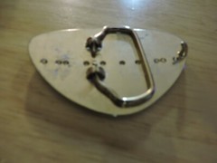 BELT BUCKLE GOLD WITH BLACK DESIGN TRIANGULAR SHAPE 3X2 INCHES