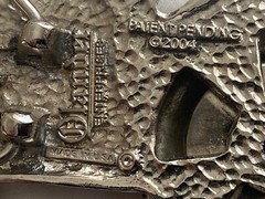 2004 Olander silver tractor belt buckle spinning back wheel