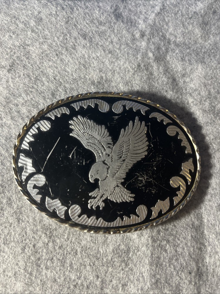 Silver-toned Belt Buckle with Black Enamel and Flying Eagle. Made in USA.
