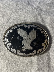 Silver-toned Belt Buckle with Black Enamel and Flying Eagle. Made in USA.