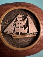 Belt buckle carved wood and pewter inlay of a sailboat
