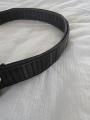 Bison Designs Tap Cap 38 mm belt featuring a gunmetal-colored bottle opener