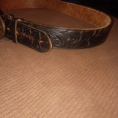 Vintage Montana Centennial Belt Buckle on antique black leather belt with design