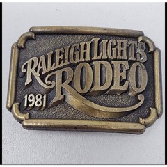 Raleigh Lights Rodeo 1981 Belt Buckle Vintage Western Cowboy Brass Tone