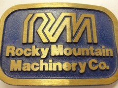 RM Rocky Mountain Machinery Co Blue & Gold Tone Belt Buckle Dynabuckle Utah